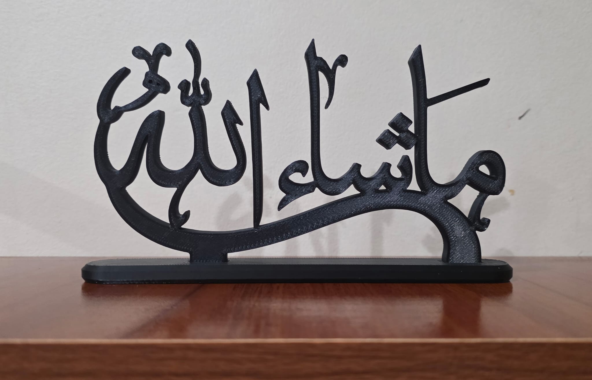 Black 3D printed Islamic calligraphy artwork